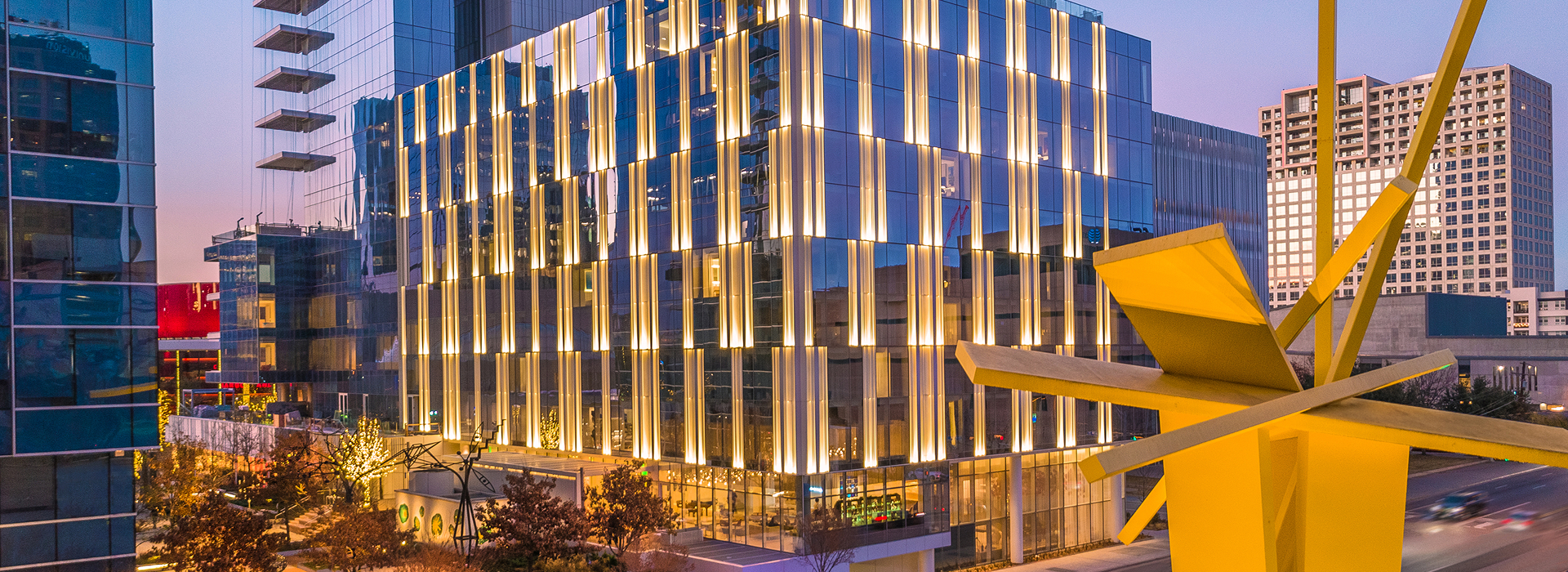 The HALL Arts Hotel features modern architecture and vibrant city lights